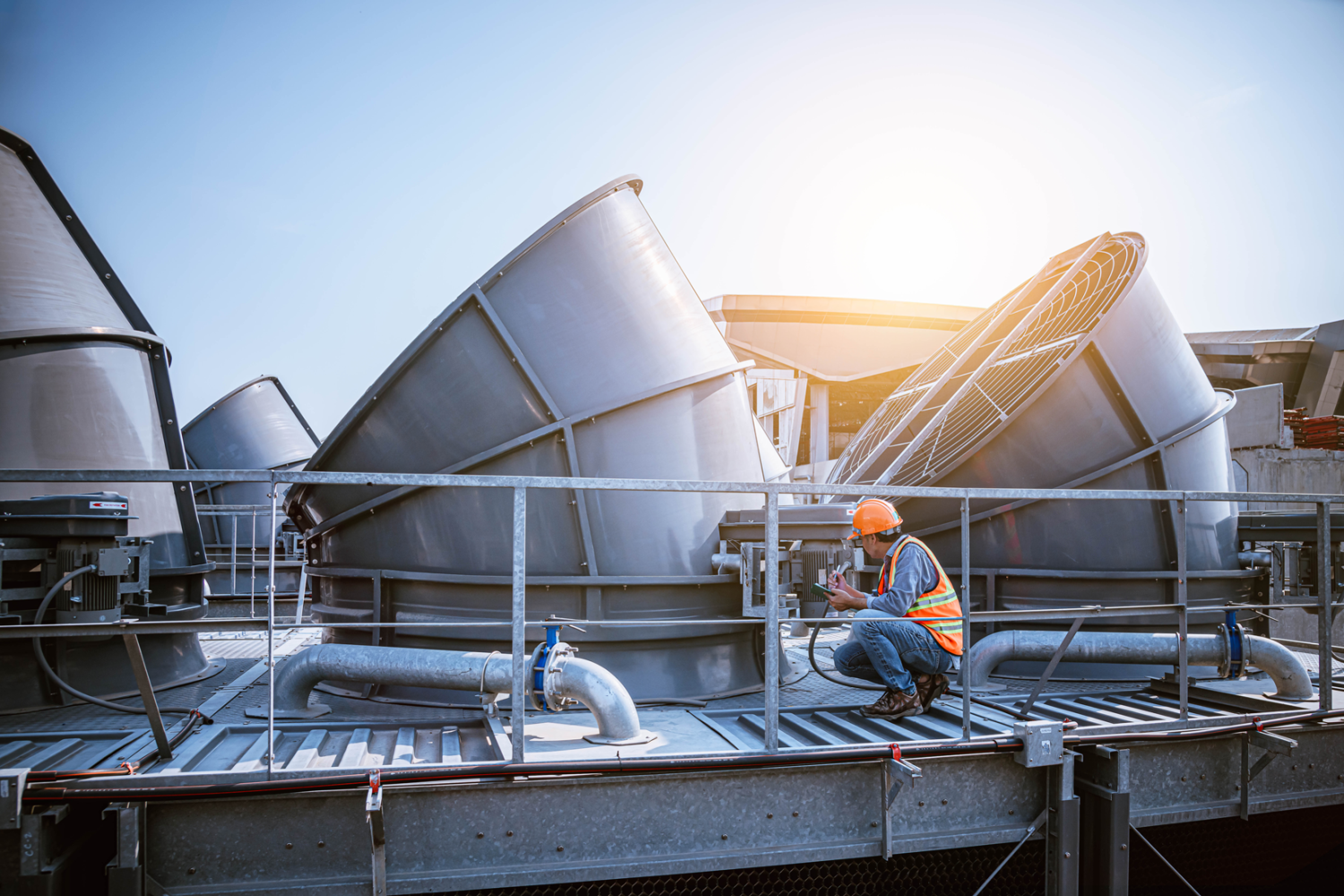 vecteezy_industry-engineer-under-checking-the-industry-cooling-tower_6668319